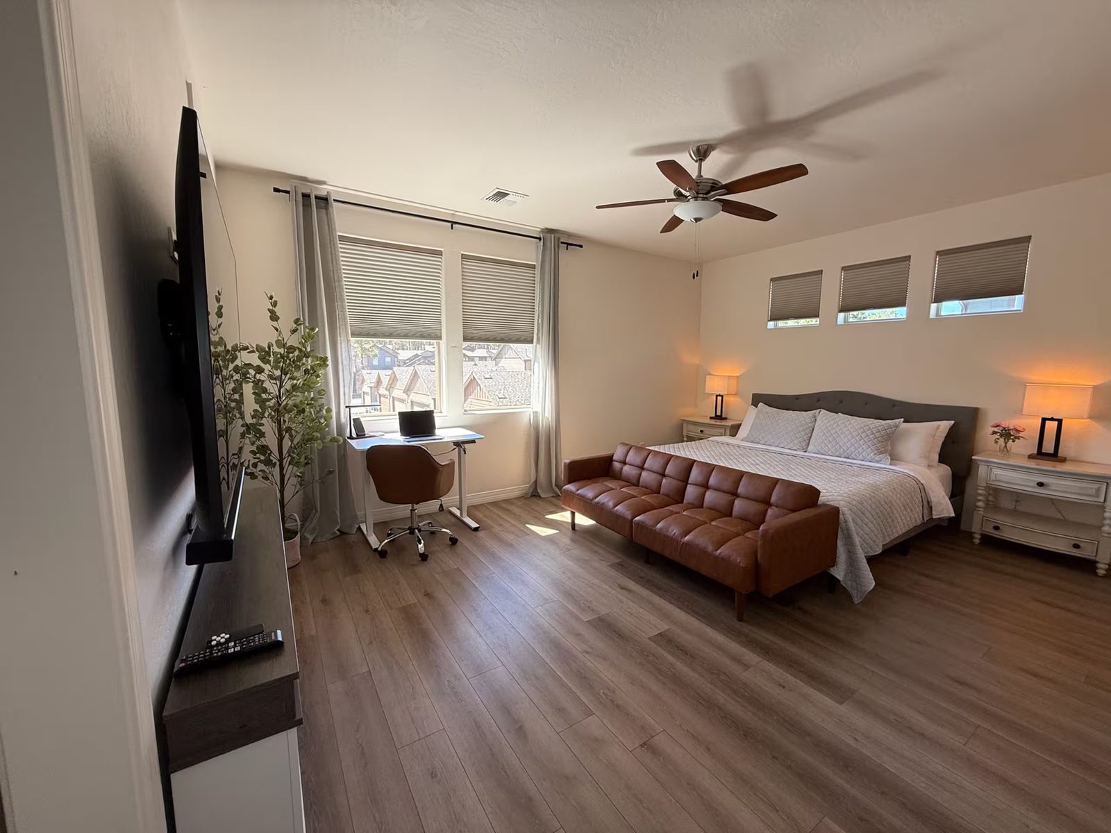Primary bedroom with king bed and walk-in closet