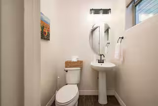 Downstairs half bath with pedestal sink