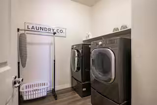 Laundry room with full-size washer and dryer
