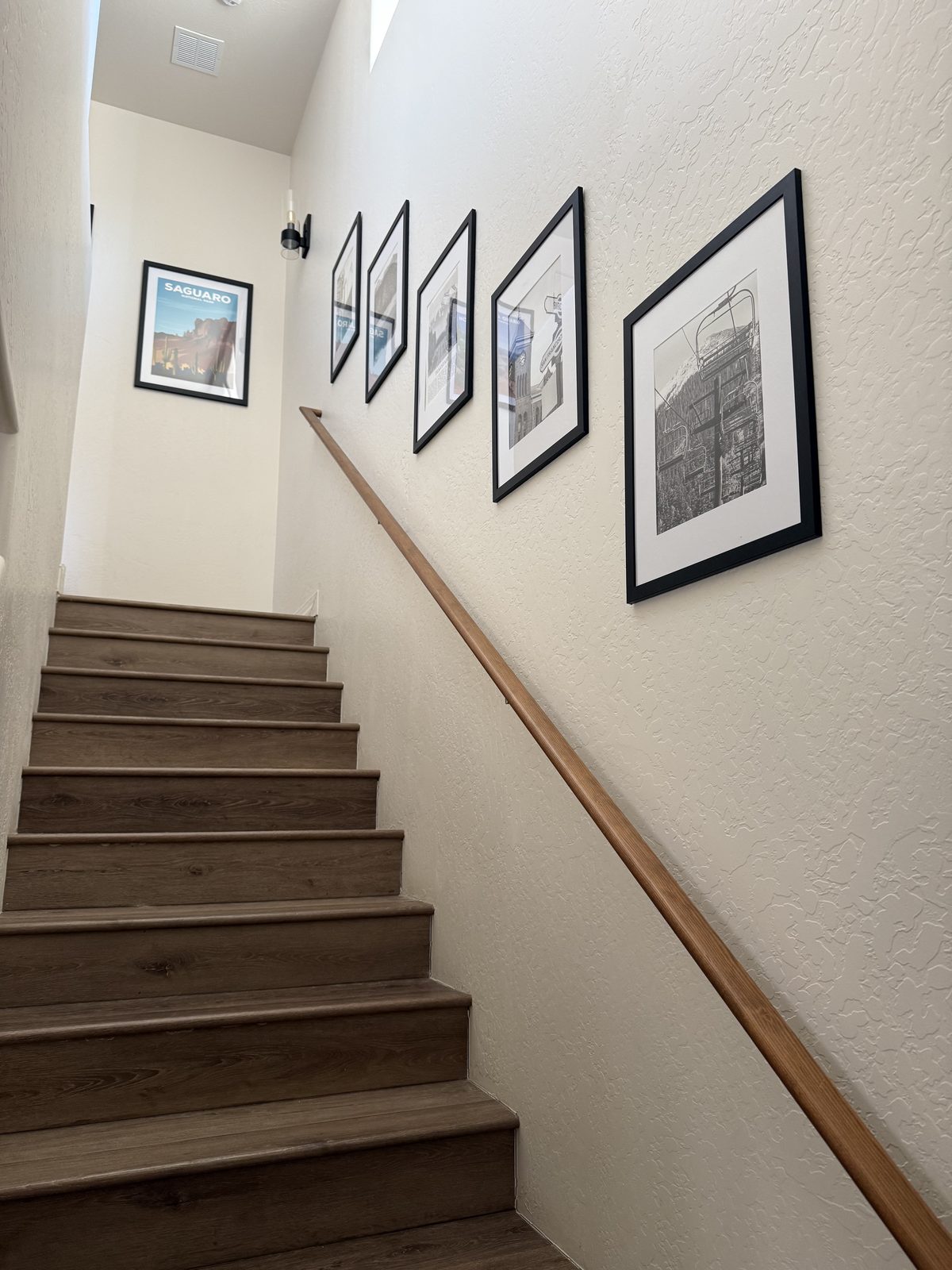 Gallery wall along the staircase